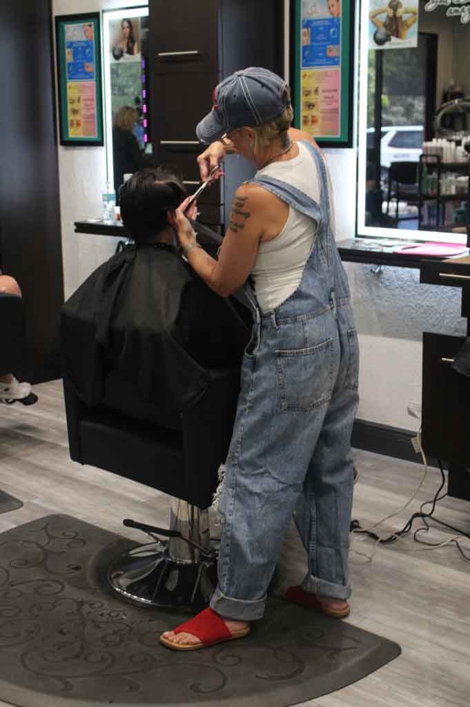 Tamra styling a client - Salon 131 Seminole